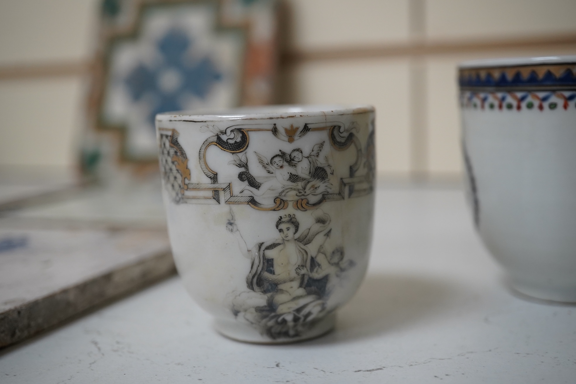 Six assorted 18th century Chinese export coffee cups with armorial decoration, and a similar European subject cup and saucer. Condition - damaged/restored